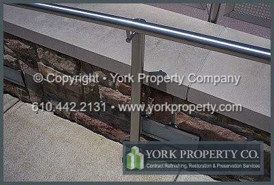 Repairing the damaged surface grain on stainless steel railings.