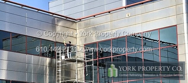Contractor providing professional scratched stainless steel window frame refinishing, oxidized stainless steel window frame restoration, pitted stainless steel window frame cleaning and dirty stainless steel window frame maintenance solutions.