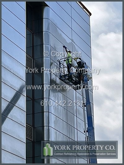 Repairing scratched stainless steel clad panels.