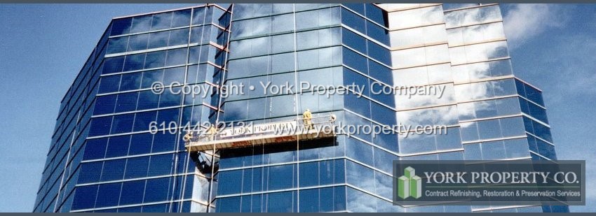 Contractor that paints faded painted aluminum curtain wall window mullions.