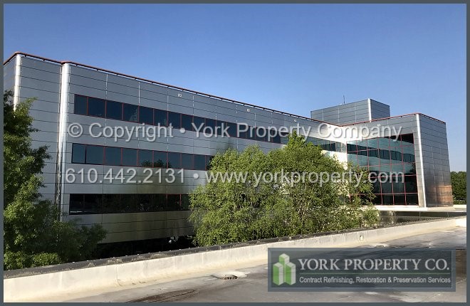 Company that cleans dirty metal building facade panels.