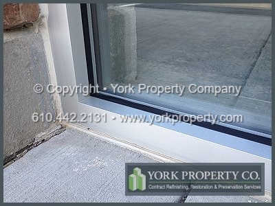 Restoring weathered and faded anodized aluminum window frames and anodized aluminum doors.