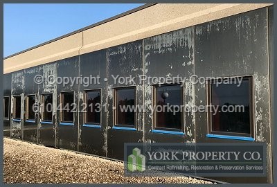 Chalked and faded lacquer removal off of anodized aluminum building facade panels.