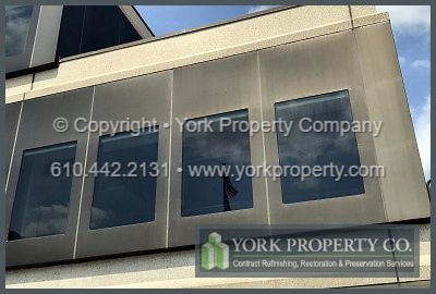 Company that gets lacquer off of bronze anodized aluminum buildings.