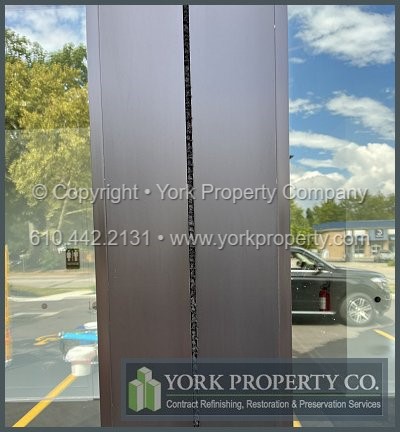 Acid damaged new anodized aluminum door frame cleaning contractor.