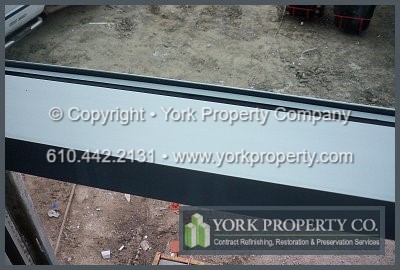 Washing weathered stainless steel window frame metal finishes. Salt water mist stainless steel cleaning, washing salt residue off of stainless steel refinishing, stainless steel maintenance washing and protecting stainless steel from salt water.