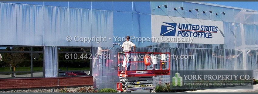 Local professional company refurbishing faded painted aluminum clad panels.