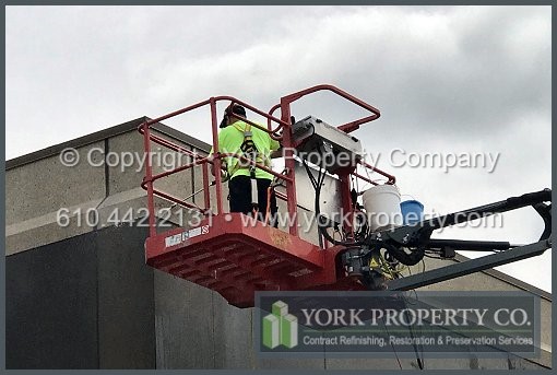Stripping peeling lacquer off of bronze anodized aluminum building facade panels.
