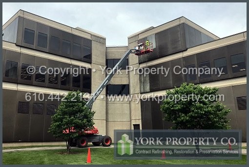 Local contractor that can get peeling lacquer off of exterior anodized aluminum clad siding panels.