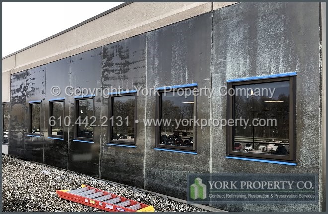 A local company that repairs the surface grain polishing weathered anodized aluminum building facaed cladding.