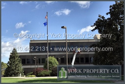 Washing anodized aluminum window frames, cleaning stained bronze anodized aluminum window frames and cleaning dirty anodized aluminum panels.