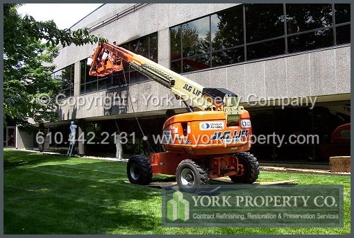 Bronze anodized aluminum curtain wall washing, restoration and long-term maintenance.