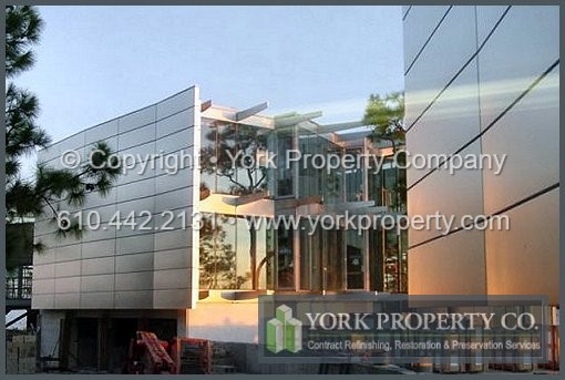 Protecting exterior 316L stainless steel clad siding panels from the effects of exposure to sun, salt and caustic damaging elements.