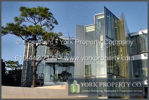 Protecting exterior stainless steel clad siding panels from the effects of exposure to sun, salt and caustic damaging elements.