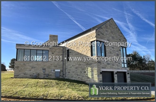 Removing hydrofluoric acid etching and corrosion stains from damaged exterior brown anodized aluminum.