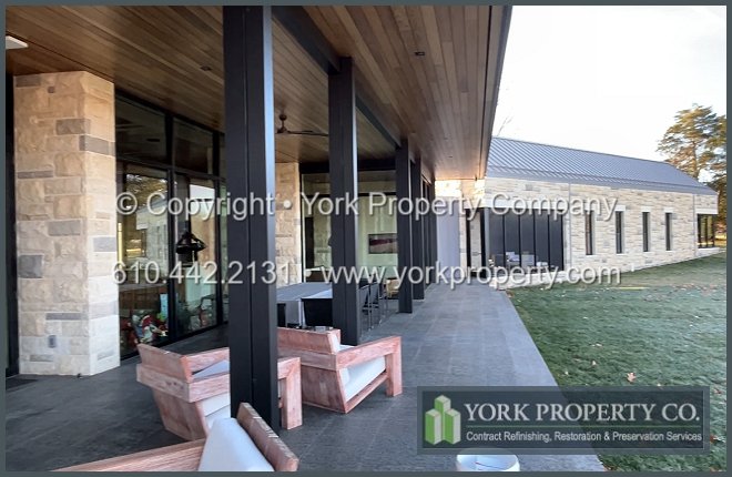 Repairing damaged anodized aluminum door frames, refurbishing stained brown anodized aluminum and restoring hydrofluoric acid etched bronze anodized aluminum storefront window frames.