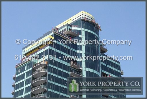Clear anodized aluminum water damage construction cleaning and anodized aluminum hard water stain removal. Refinishing calcium stained anodized aluminum curtain wall window frames, restoring mineral deposit stained anodized aluminum door frames and cleaning water damaged anodized aluminum mullions.