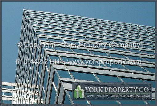 Aluminum column cover cleaning, sun faded and weathered aluminum refinishing and aluminum corrosion protection.