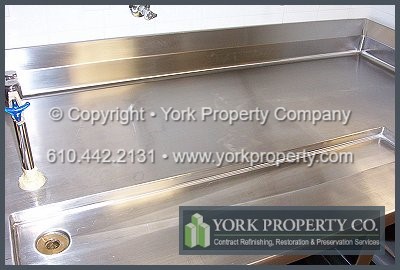 Repairing and refurbishing scratched and damaged stainless steel commercial sink and counter top.