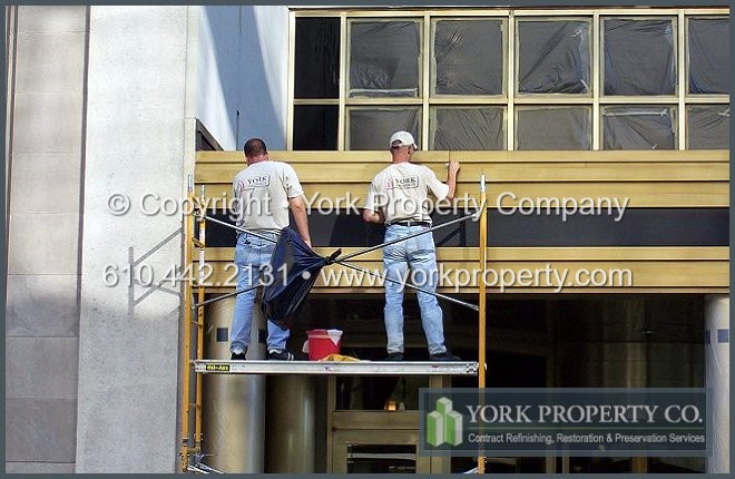 Refinishing brass panels and brass siding cladding.