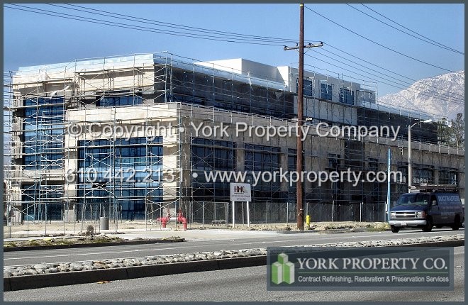Cleaning, repairing and restoring concrete, mortar and stucco damaged anodized aluminum storefront window frames and anodized aluminum mullions.