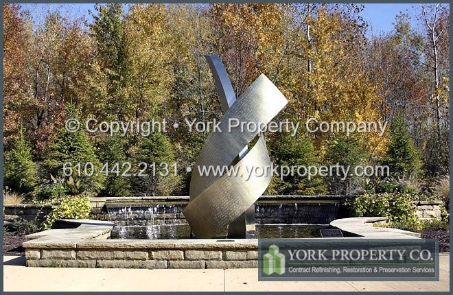 Stainless steel statue refinishing.