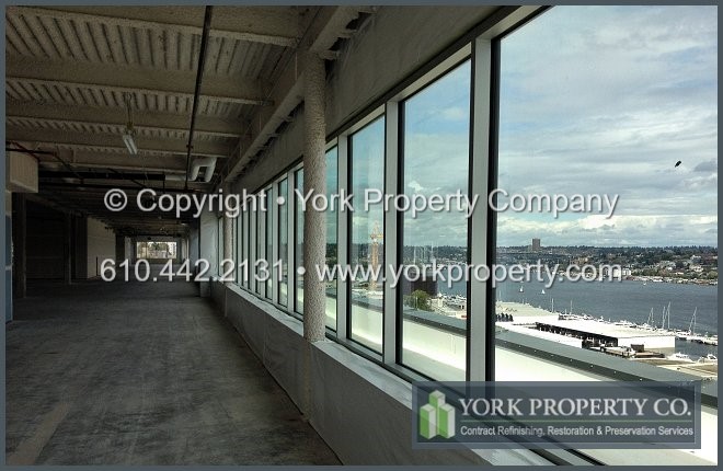 We are interior clear anodized aluminum restoration experts at getting iron oxide rust deposits off of our commercial clients anodized window frames and mullions.