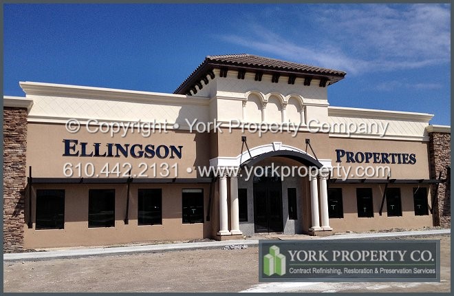 Stucco splatter stained anodized aluminum window frame construction cleaning chemicals.