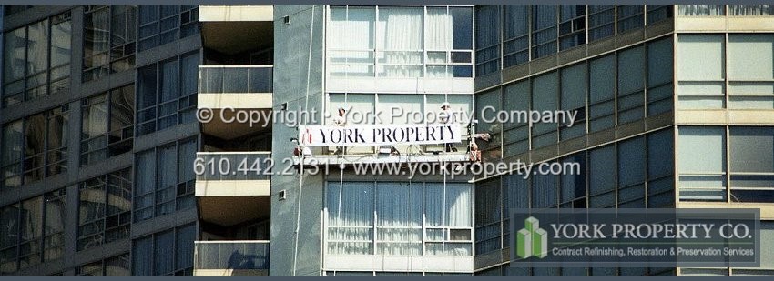 Cleaning dirty painted aluminum building facade clad panels.