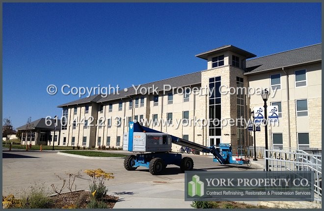 Exterior clear anodized aluminum window frame restoration cleaning and anodized aluminum concrete, mortar and cement overspray removal.
