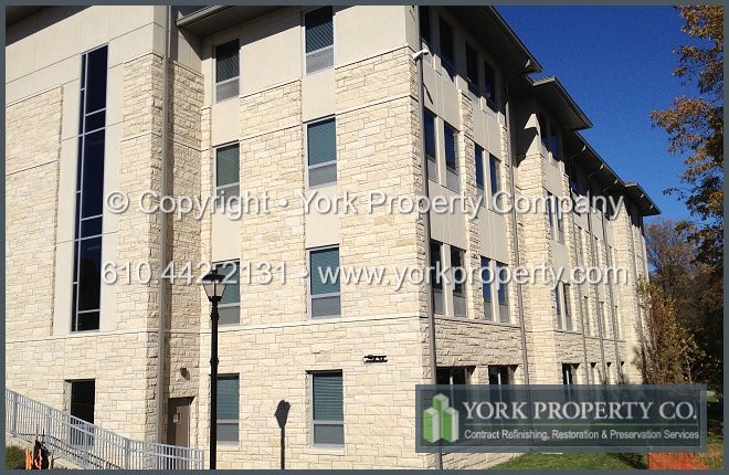 Cleaning stucco stained clear anodized aluminum window frames.