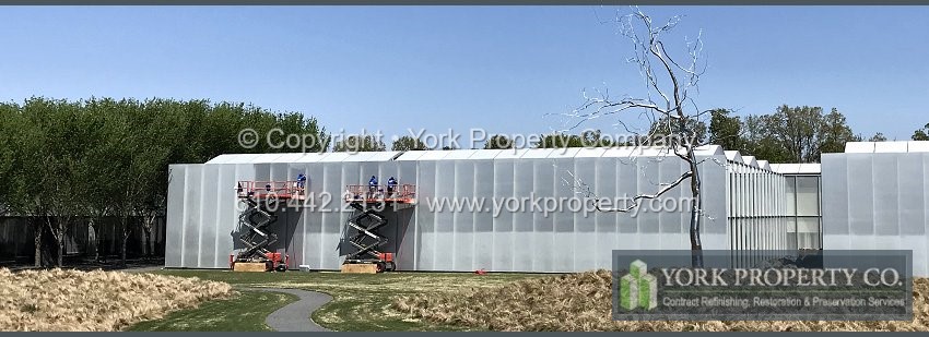 Cleaning dirty anodized aluminum building facade clad panels.