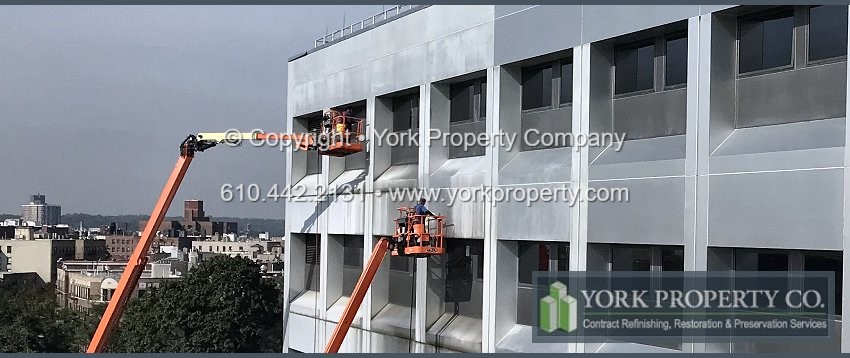 Cleaning old dirty anodized aluminum building facade clad panels.