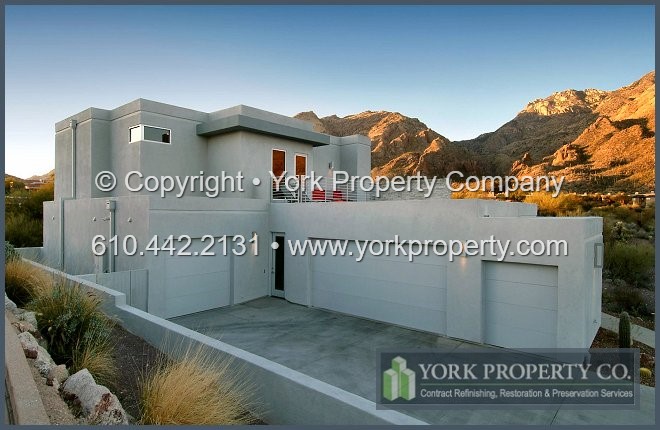 Exterior clear anodized aluminum restoration cleaning and anodized aluminum concrete, mortar and cement overspray removal.