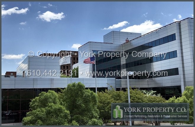 Dirty metal building facade panel environmentally friendly cleaning chemicals.