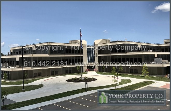 We repair the grain on scratched and damaged medium bronze anodized aluminum wall panels.