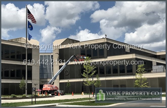 Local company that gets the stains off of old anodized aluminum building facade panels.