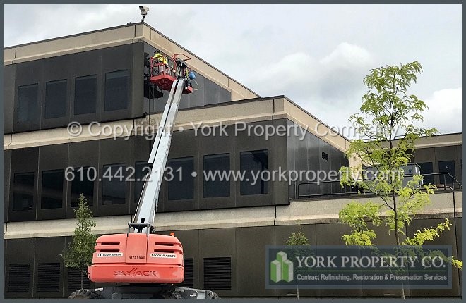 Company the cleans dirty anodized aluminum building facade wall paneling.