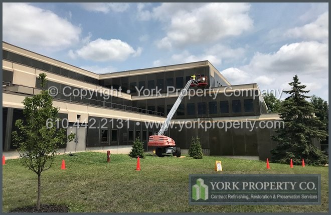 Professional oxidized anodized aluminum building facade panel restoration contractor.