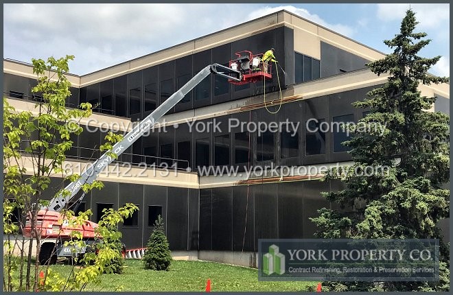 The experts at restoring old anodized aluminum building facade panels.