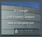 Faded, corroded, weathered and silicone stained anodized aluminum building facade panel refinishing. We specialize in anodized aluminum preventive maintenance, anodized aluminum refinishing, anodized aluminum power washing and anodized aluminum pressure cleaning.