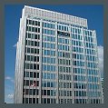 Dull, dirty, faded and oxidized anodized aluminum curtain wall refinishing and bleached anodized aluminum restoration.