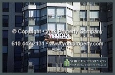 Faded painted metal cleaning, refinishing and restoration of exterior building panels.